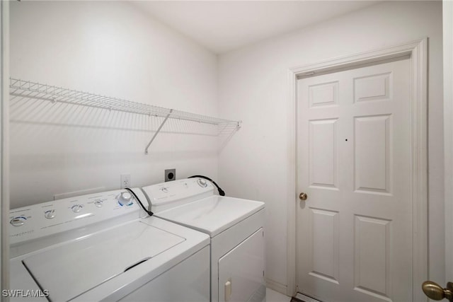 washroom featuring independent washer and dryer