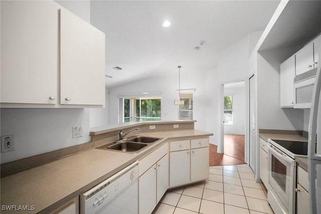 kitchen featuring pendant lighting, white cabinetry, white appliances, and sink