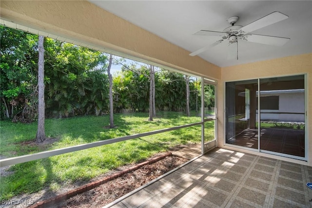 unfurnished sunroom with plenty of natural light and ceiling fan