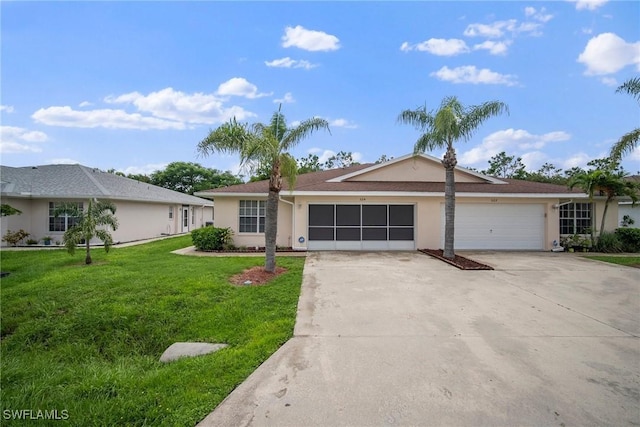 ranch-style home with a garage and a front lawn