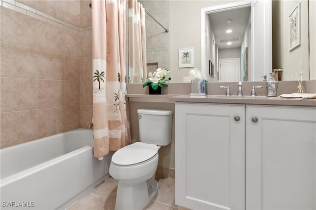 full bathroom featuring tile patterned floors, toilet, vanity, and shower / bathtub combination with curtain