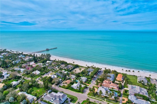 birds eye view of property with a beach view and a water view