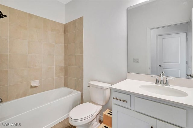 full bathroom with vanity, toilet, and tiled shower / bath