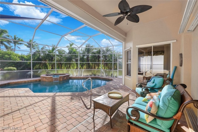 view of swimming pool featuring a lanai, ceiling fan, a patio area, and an in ground hot tub