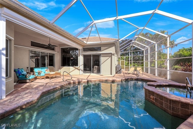 view of pool featuring ceiling fan, a patio area, and an in ground hot tub