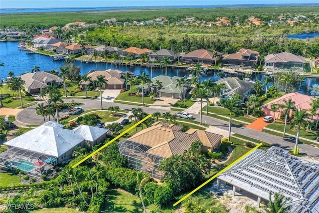 birds eye view of property with a water view