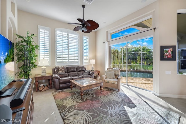 tiled living room featuring ceiling fan