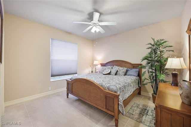 tiled bedroom featuring ceiling fan