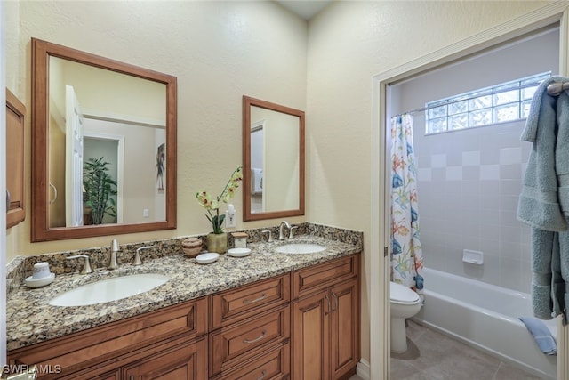 full bathroom featuring tile patterned floors, vanity, shower / bath combination with curtain, and toilet