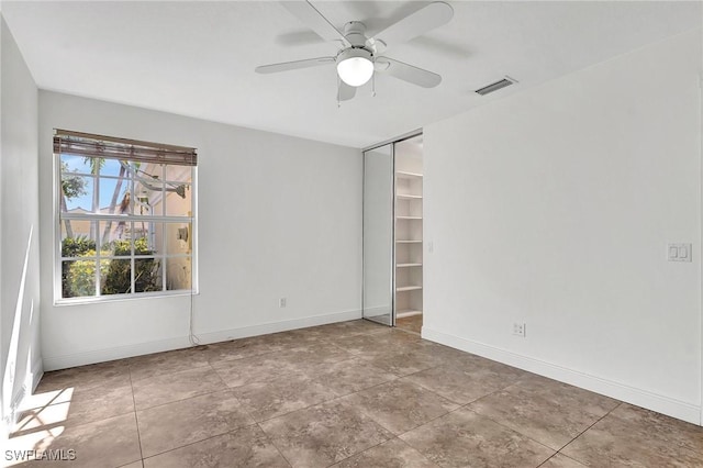 unfurnished room featuring ceiling fan