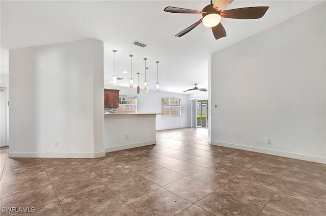 unfurnished living room with vaulted ceiling and ceiling fan