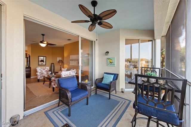 sunroom / solarium with ceiling fan