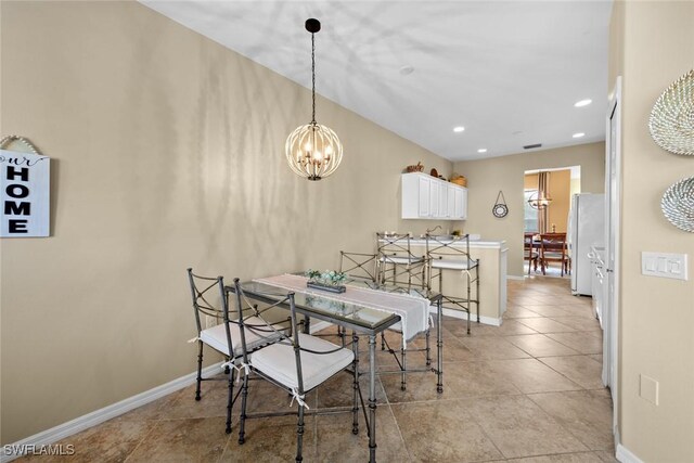 dining area featuring an inviting chandelier