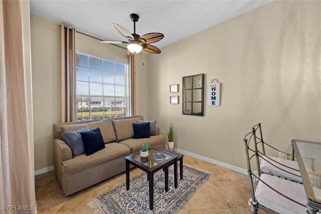 tiled living room with ceiling fan