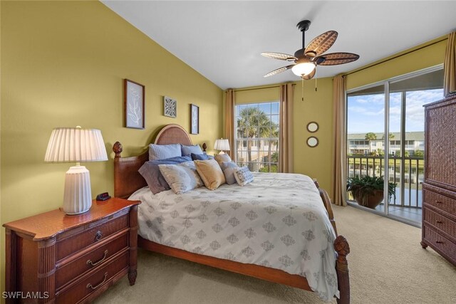 bedroom with access to exterior, light colored carpet, vaulted ceiling, ceiling fan, and a water view