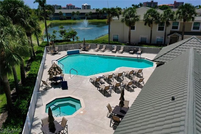 view of pool with a water view