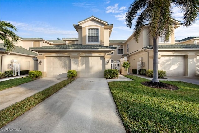 view of front of property with a garage and a front yard