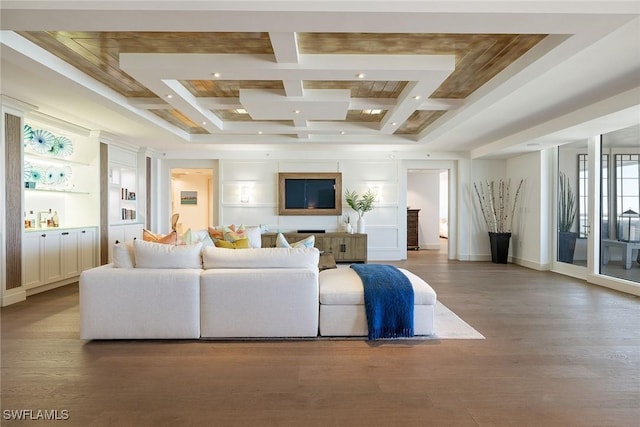 living room with coffered ceiling, beam ceiling, built in features, and wood-type flooring