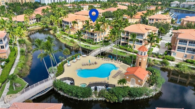 bird's eye view of a nearby body of water and a pool