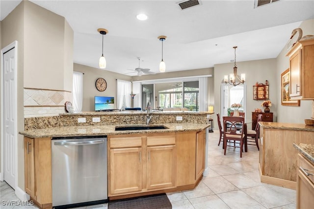 kitchen featuring dishwasher, light brown cabinets, ceiling fan with notable chandelier, sink, and decorative backsplash