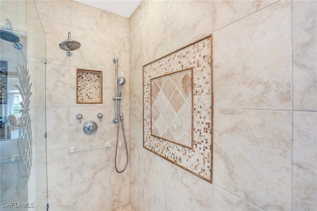 bathroom with tiled shower