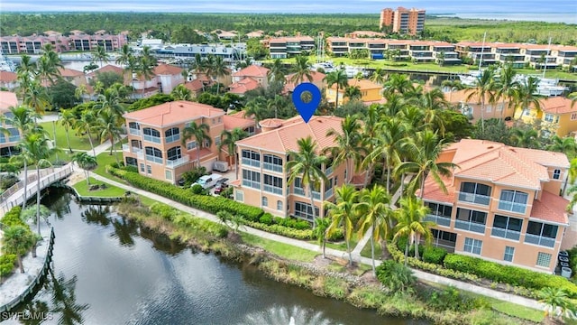 drone / aerial view with a water view