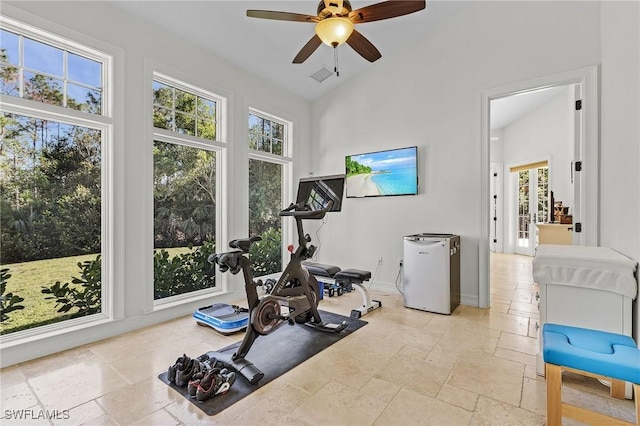 workout area with ceiling fan and lofted ceiling