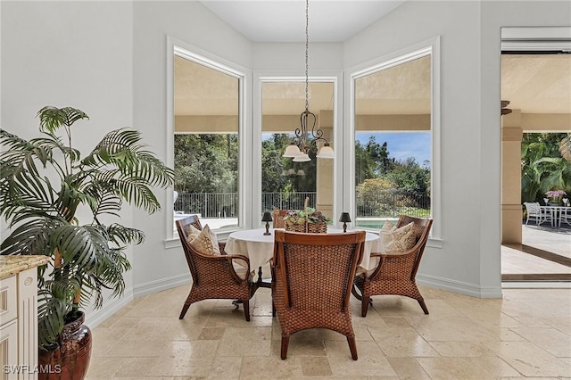 sunroom with an inviting chandelier