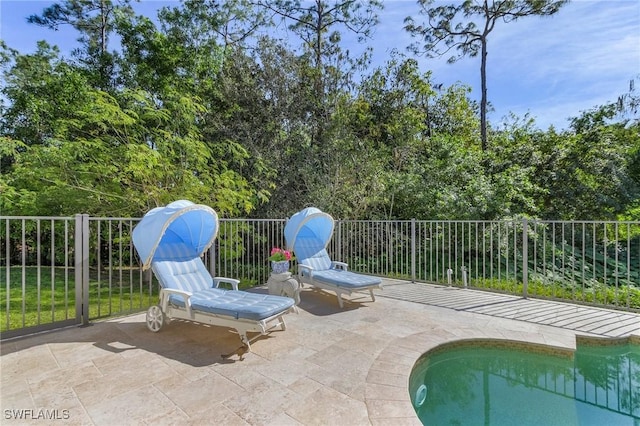 view of patio featuring a fenced in pool