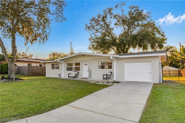 ranch-style house with a front yard and a garage