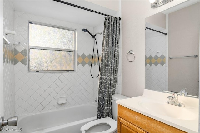 full bathroom with shower / tub combo, vanity, and toilet