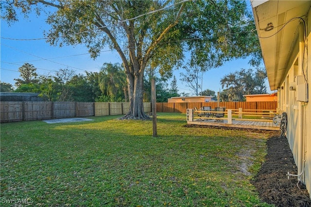 view of yard featuring a wooden deck