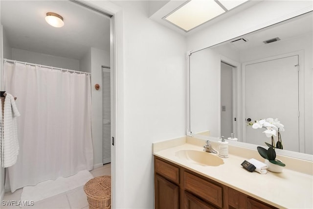 bathroom featuring vanity and tile patterned flooring