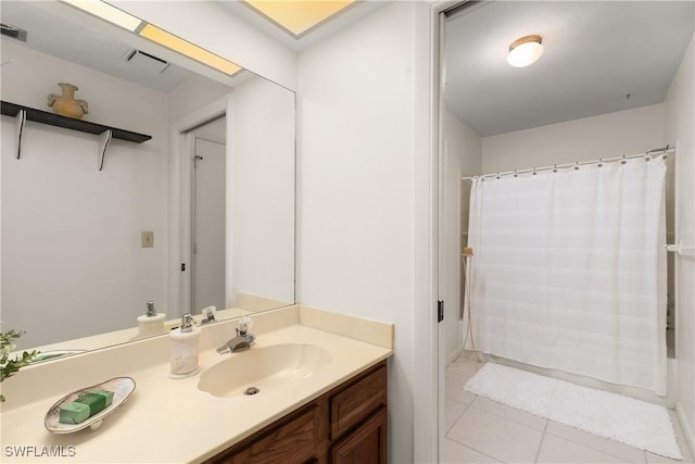 bathroom with vanity and tile patterned floors