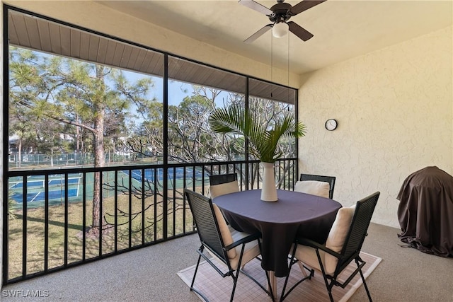 sunroom / solarium with ceiling fan