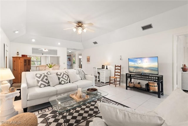 tiled living room with vaulted ceiling