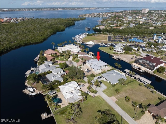 birds eye view of property featuring a water view