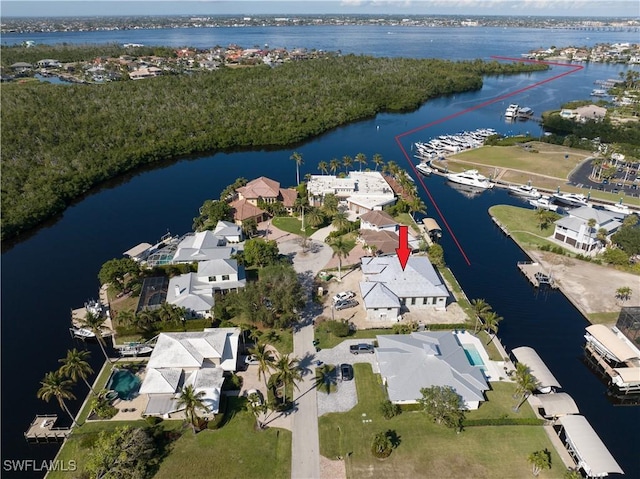 birds eye view of property with a water view