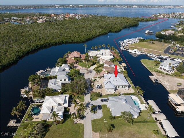 birds eye view of property featuring a water view