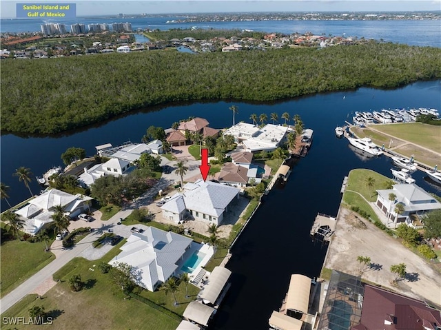 birds eye view of property featuring a water view