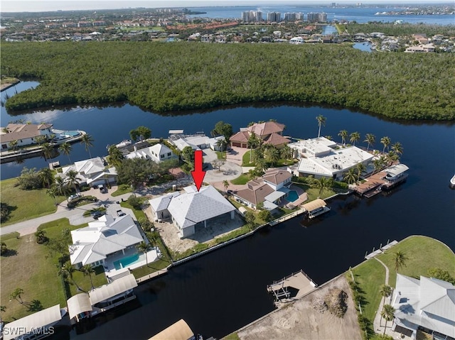 birds eye view of property featuring a water view