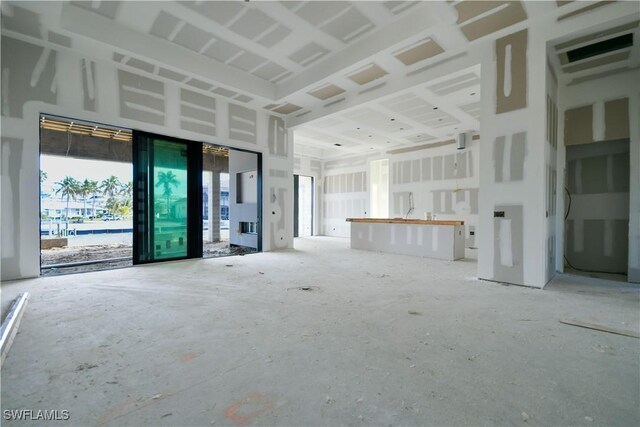 unfurnished living room with a healthy amount of sunlight