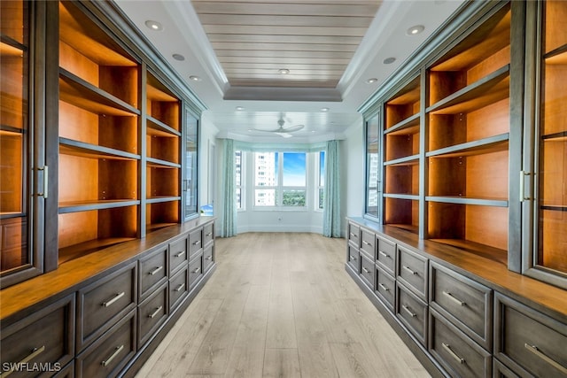 mudroom featuring ceiling fan, a raised ceiling, light wood-type flooring, wood ceiling, and ornamental molding