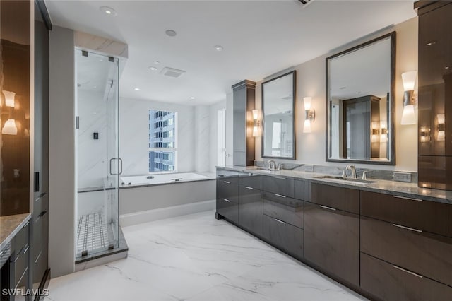 bathroom featuring vanity and plus walk in shower