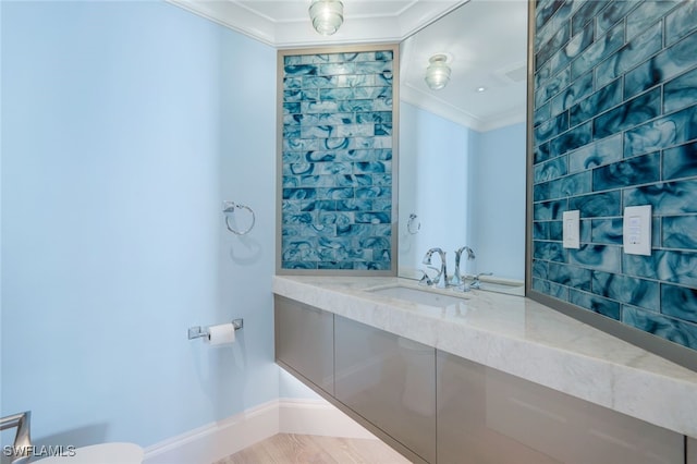 bathroom with vanity and crown molding