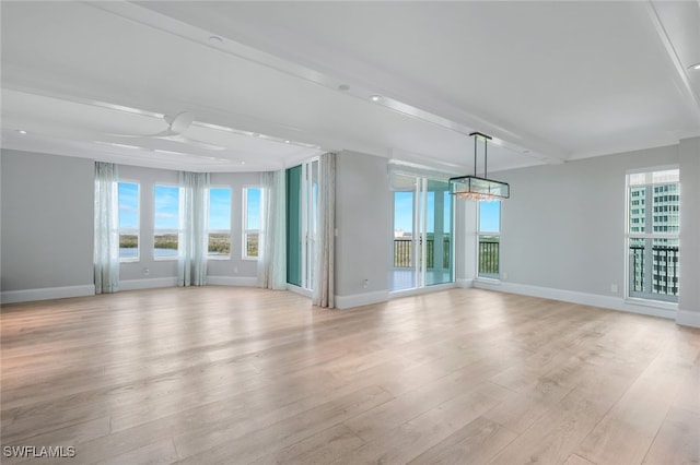 empty room with beamed ceiling, light wood-type flooring, and ceiling fan