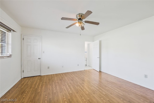 unfurnished room with hardwood / wood-style floors and ceiling fan