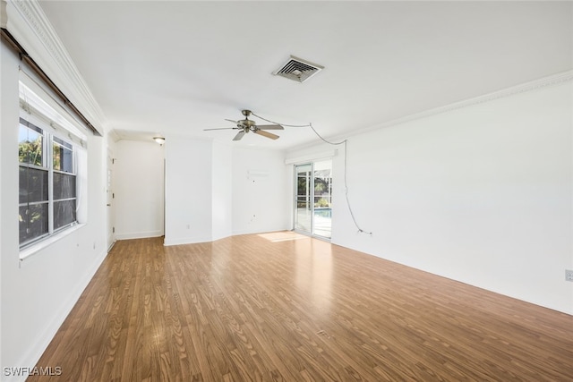 spare room with ceiling fan, hardwood / wood-style floors, and ornamental molding