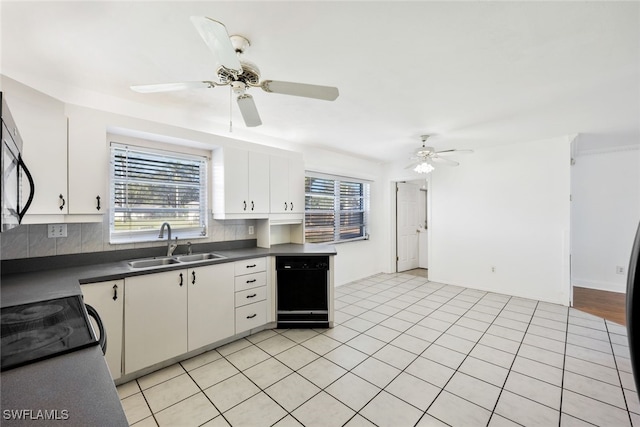 kitchen featuring white cabinets, light tile patterned floors, tasteful backsplash, and sink