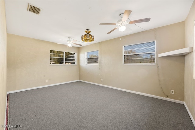 empty room with carpet floors and ceiling fan